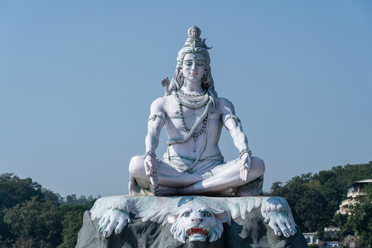 Statue of meditating Hindu god Shiva on the Ganges River at Rishikesh village in India