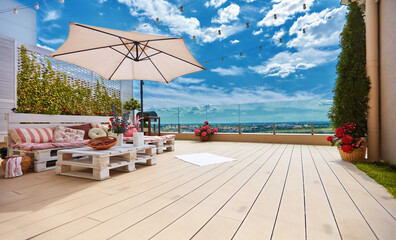 cozy rooftop patio with pallet furniture lounge zone and beautiful landscape view