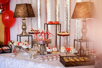 Delicious sweet buffet with cupcakes. Sweet holiday buffet with cupcakes and other desserts. Candy Bar.