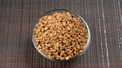 Organic fenugreek seeds, ingredient in Indian cuisine.