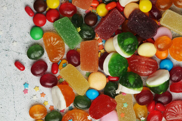 Bright candy lollies on white background	