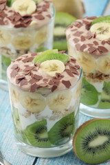 Trifle desserts with bananas, kiwi and yogurt