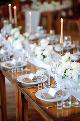 Beautiful table setting for a party, wedding reception or other festive event. Banquet setting, glasses, plates.