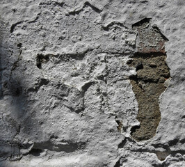Abstract rectangular white texture. White washed old brick wall with mint and shabby uneven plaster. Painted white gray background.