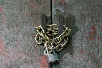 Vintage, grunge, door secured by padlock and chain