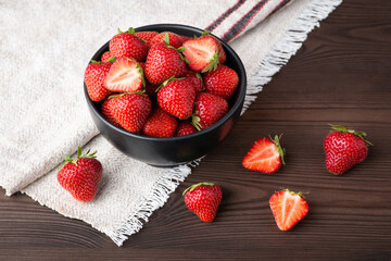 Beautiful composition of strawberry on dark wooden tabel. Concept of strawberry, berry background