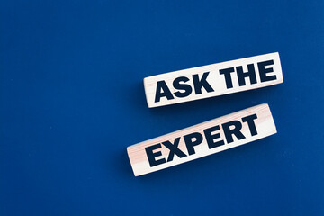 Ask the Expert words on wooden blocks. Consulting a professional, master or consultant for a solution and advice business concept.