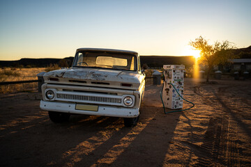 Car old truck in the desert sunset