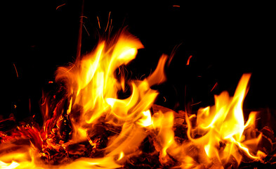 Fototapeta na wymiar Flame of fire on a black