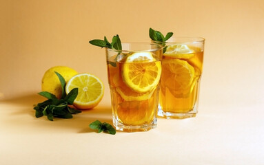 Delicious iced tea with lemon and mint in a glasses