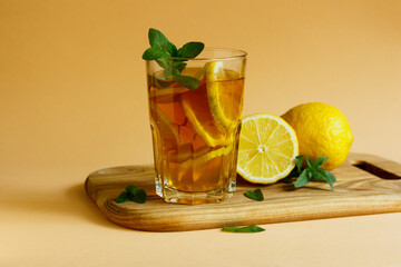 Refreshing Iced Tea Out Of Black Tea, Lemon Slices, Garnished With Fresh Mint Leaves