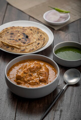 chicken butter masala served with lachha parantha