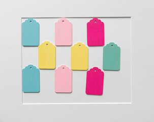 neatly arranged retro wooden tags on a white paper background with accent frame