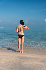 chinese woman on a beach in penang malaysia