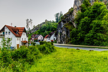 Obraz premium buildings and rock formation in an upper franconian village