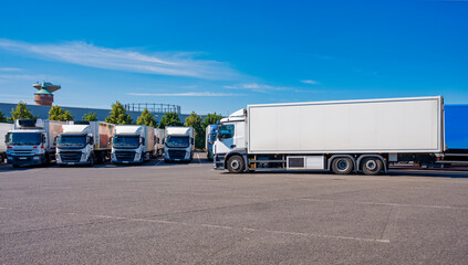 parking Trucks. Vehicles of transportation companies waiting at a truck stop.