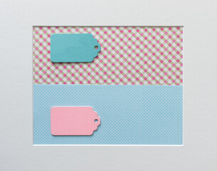 old school or retro chalkboard tags arranged on a patterned paper background, with a mat board...