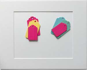 old school or retro chalkboard tags, loosely arranged on a light paper background, with a mat board...