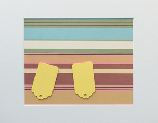 old school or retro chalkboard tags arranged on a patterned paper background, with a mat board...