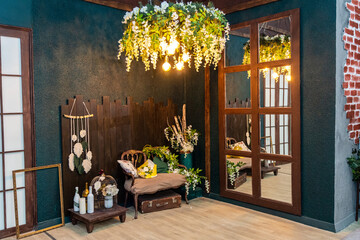 Beautiful retro photozone in studio with giant chandelier