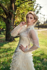 Girl model with white hair in a retro dress with ruffles