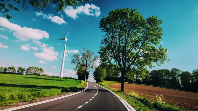 Driving country road at sunny summer day. Travel background, 4K	