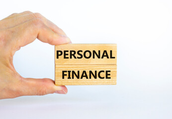 Personal finance symbol. Wooden blocks with words Personal finance on beautiful white background, copy space. Businessman hand. Business and Personal finance concept.