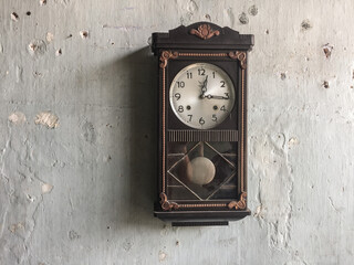 antique clock on texture wall