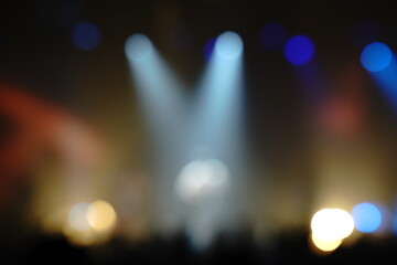 Defocused entertainment concert lighting on stage, blurred disco party.