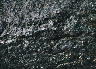 Rough black stone texture. Natural grunge background.