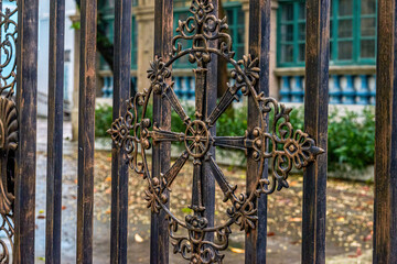 Western-style patterns on the iron fence of a Christian church