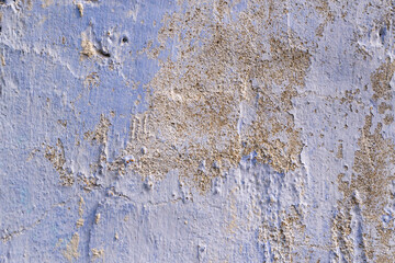 Texture of an old plastered wall, whitewashed in blue. Close-up, wallpaper, background.