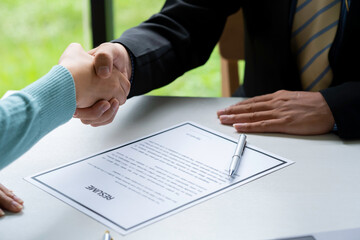 Businessperson Shaking Hand With Candidate, Job applicant having the interview manager shaking hands in a contemporary office. Human resources concept.