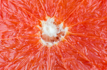 Grapefruit texture inside on the white background. Citrus close up photo. Healthy lifestyle photo. Beautiful wallpaper. Vegetarian and vegan concept. Vitamins from nature.