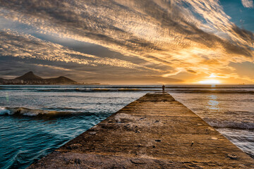 Incredible sunset sky with pier into the sea, Cape Town, South Africa