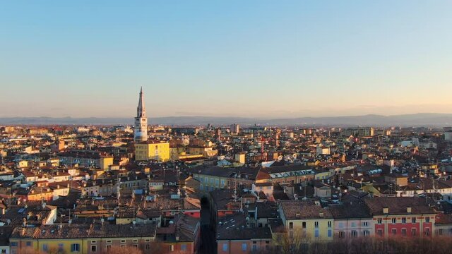 aerial view drone of modena at sunset rising up over historic city center,emilia romagna italy 4k
