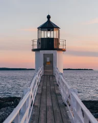 Fototapeten A lighthouse on a pier, Marshall Point Lighthouse, Saint George, Maine © jonbilous