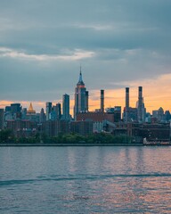 View of the Manhattan skyline at sunset, from Domino Park, Williamsburg, Brooklyn, New York