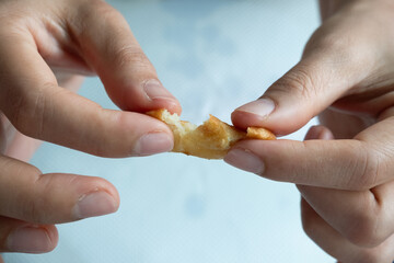 Homemade Churros short stick. Churos are fried dough sprinkled with sugar. It looks like a long bar and is eaten by dipping it with hot chocolate or coffee milk when eaten.