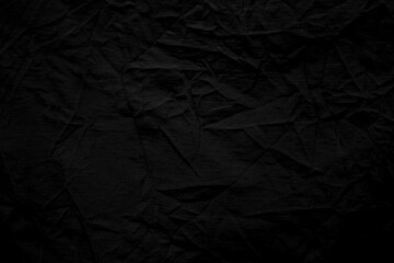 black crumpled paper background