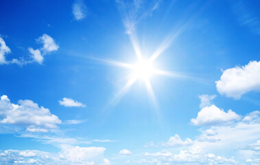 Naklejka na ściany i meble sun with blue sky clouds