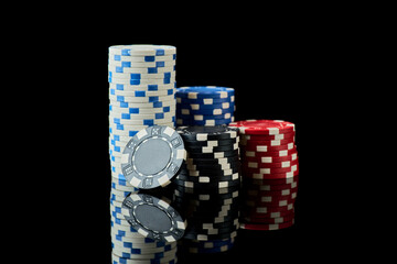 Stack of Casino gambling chips isolated on black