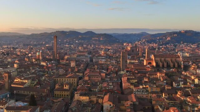 aerial view drone of bologna historic city centre,flying forward over downtown at dawn revealing the main monuments,emilia romagna italy 4k