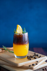 americano black coffee and juice on the wooden background.