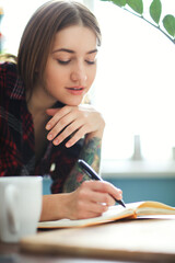 Lovely girl at home
Study and education. Girl with laptop does homework
