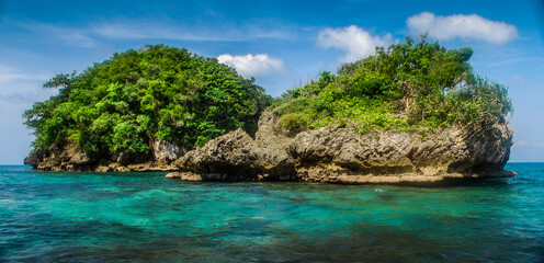 Rock Islands over crystal clear sea water. 