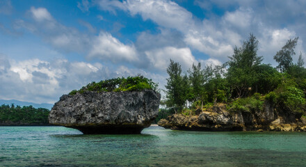 Rock Islands over crystal clear sea water. 