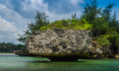 Rock Islands over crystal clear sea water. 