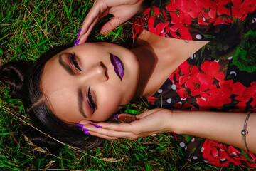 woman laying on grass