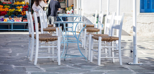 Greek island outdoor cafe bar table, sunny day